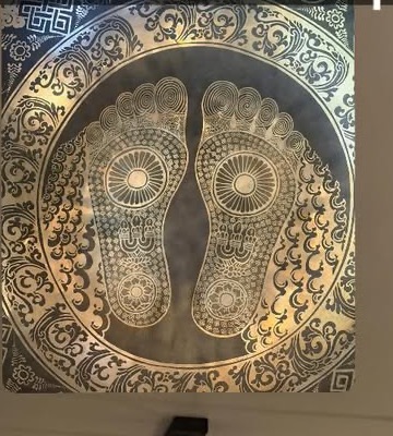 Brass Ashiatsu footprint plate in the treatment room
